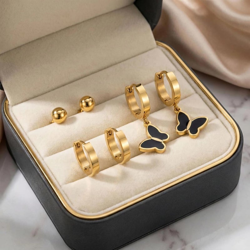 طقم ٣ أزواج حلقان ذهبي مميز: بريمة الكرة الذهبية، حلقات سادة لامعة، فراشة سوداء متدلية فاخرة. من الستانلس ستيل المقاوم للصدأ، لإطلالة لامعة وعصرية. - Image 5